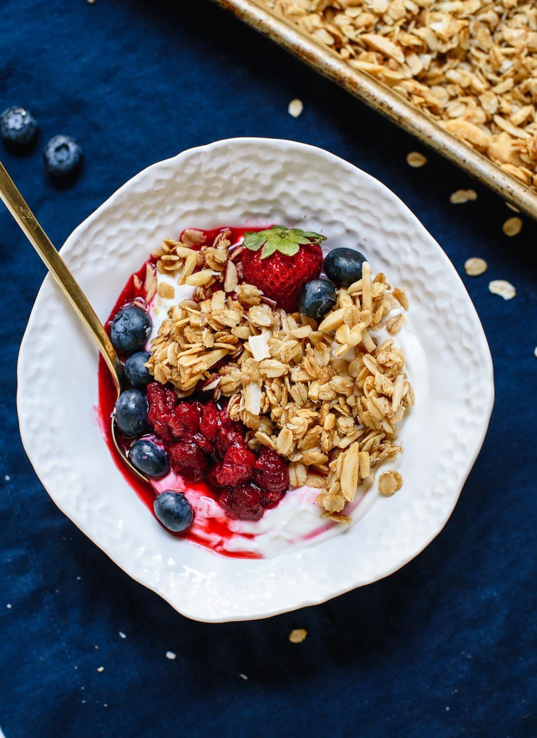 Crisp coconut granola made with two kinds of coconut, coconut oil and maple syrup! cookieandkate.com